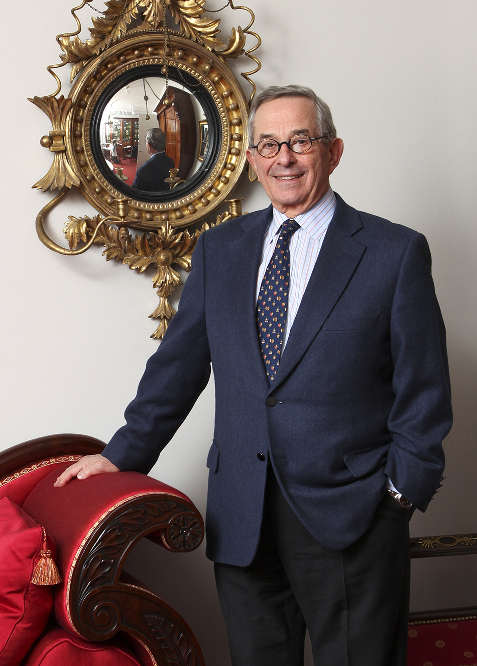 In his office, Stuart stands in front of one of a pair of girandole mirrors, made in Philadephia in 1810, with his hand resting on a circa 1826 sofa attributed to Isaac Vose of Boston.