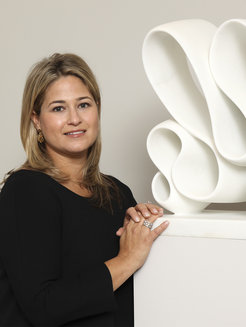 Liz stands with a white-marble sculpture by Elizabeth Turk, one of 20-plus contemporary artists represented by the gallery.