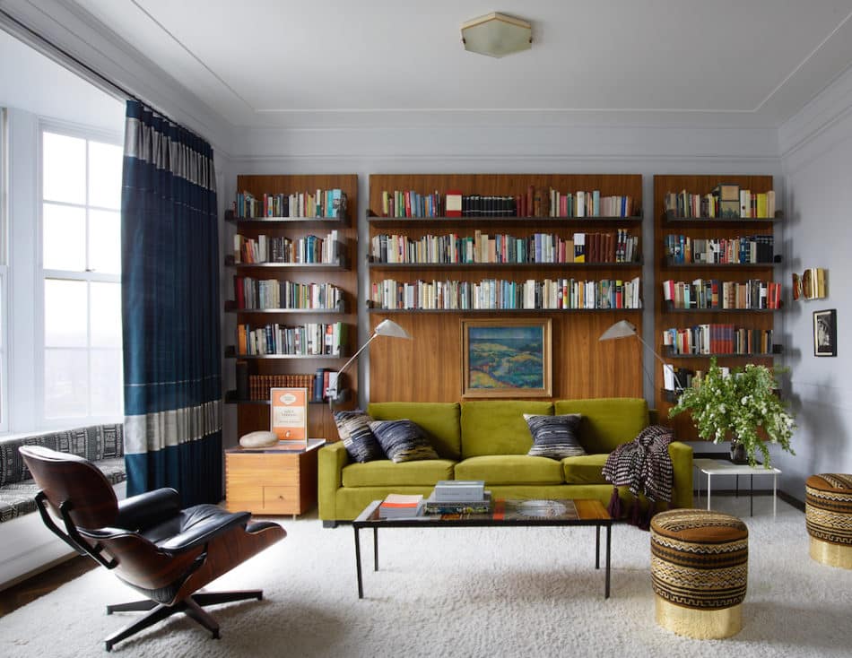 living room with green couch and stools