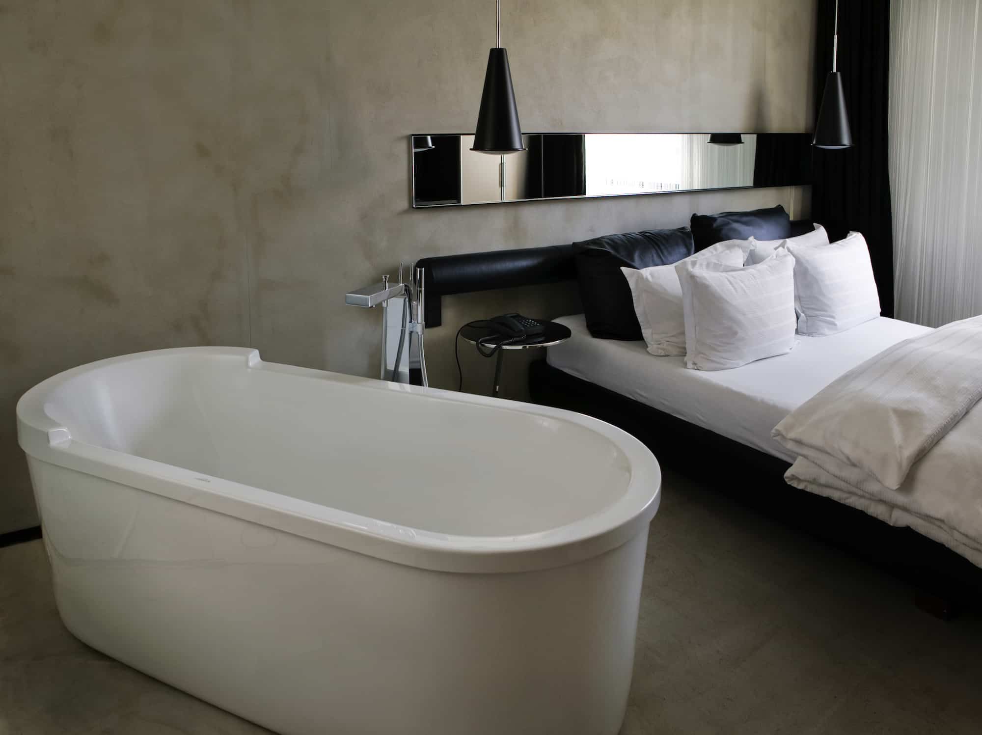 A guest room in Reykjavík’s Hotel Thingholt, designed by Gulla Jónsdóttir. The best is custom, and the hanging lamps are by Tom Dixon.