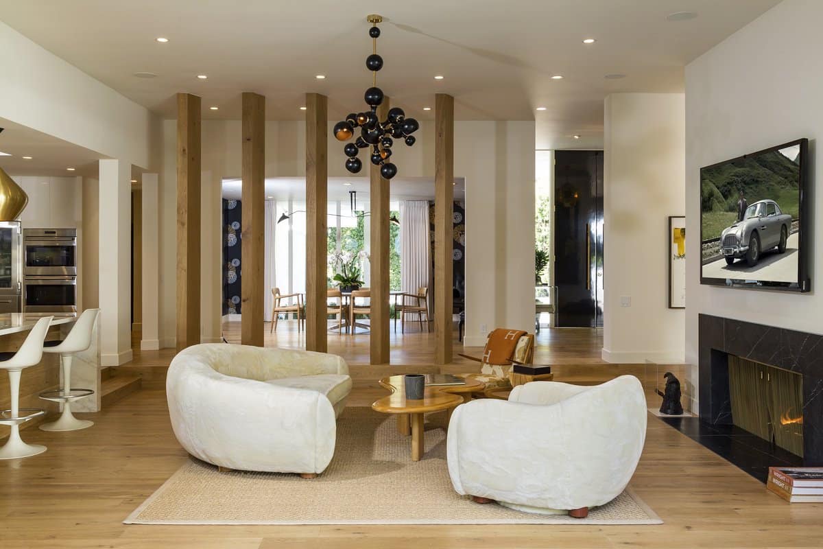 Round furniture provides visual interest in this Beverly Hills living room by Trip Haenisch. Photo by Beryln Photography