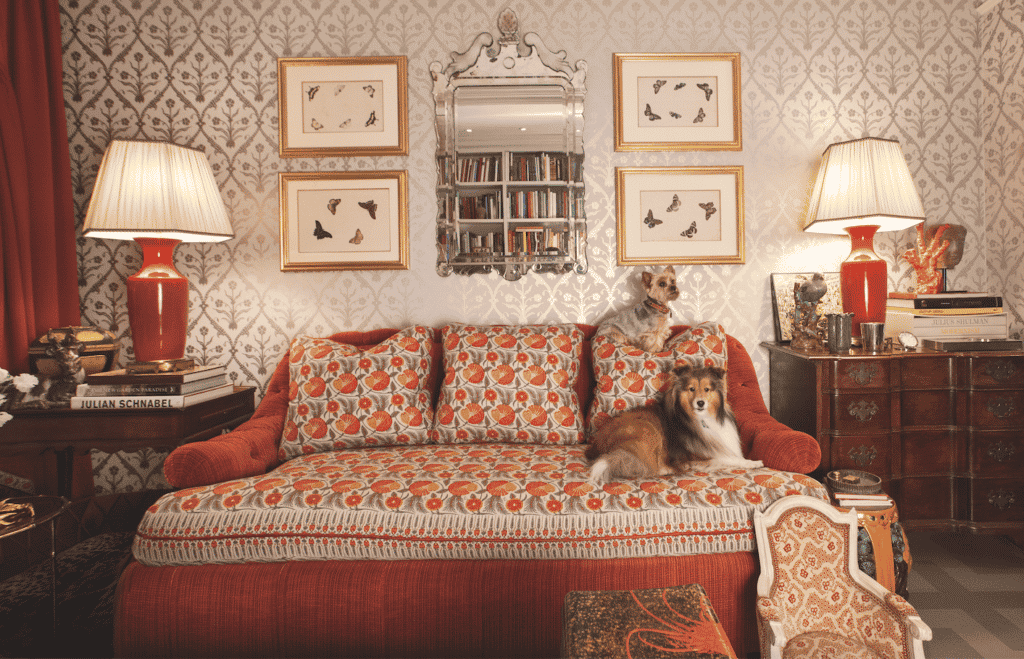 two dogs on a red sofa