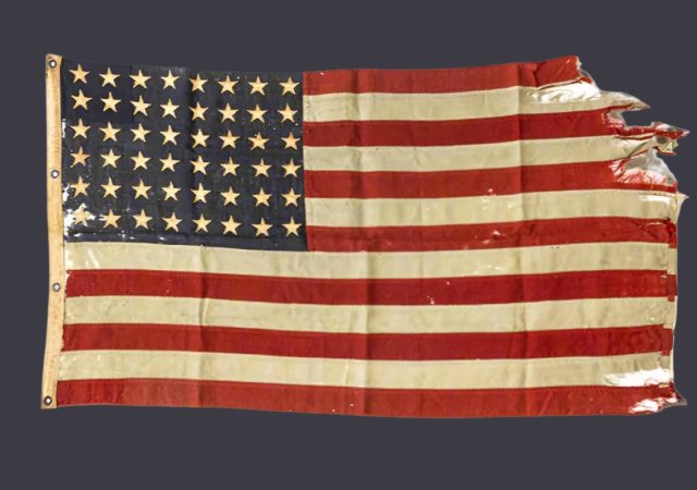 featured image for post: This Battle-Scarred American Flag Was Flown on D-Day