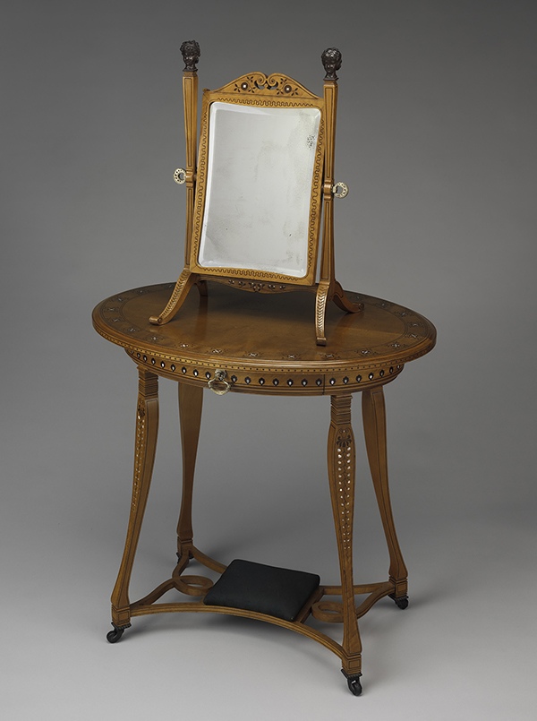 A dressing glass Schastey created for the dressing room includes mother-of-pearl and brass detailing, while the room's Schastey-designed dressing table still features its original upholstery.