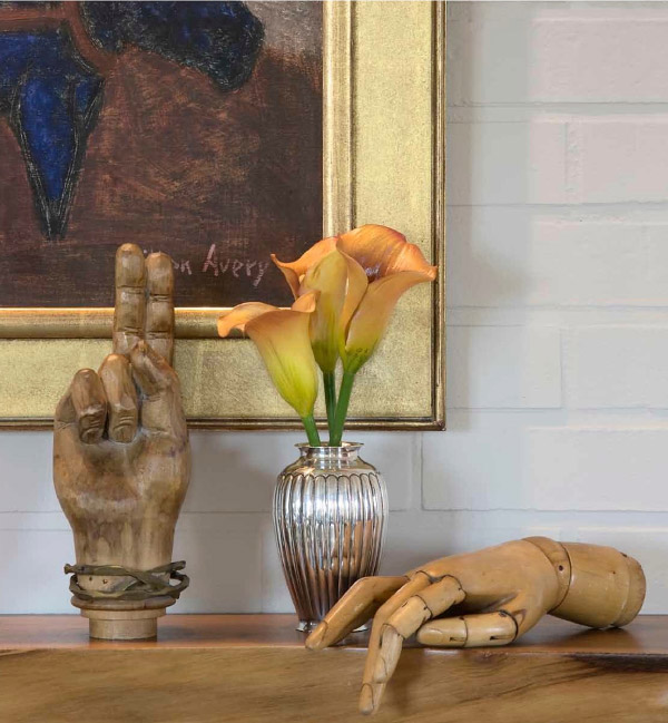 In a Greenwich Village apartment, a landscape by Milton Avery hangs over a custom-made George Nakashima mantel shelf. Photo by Kris Tamburello