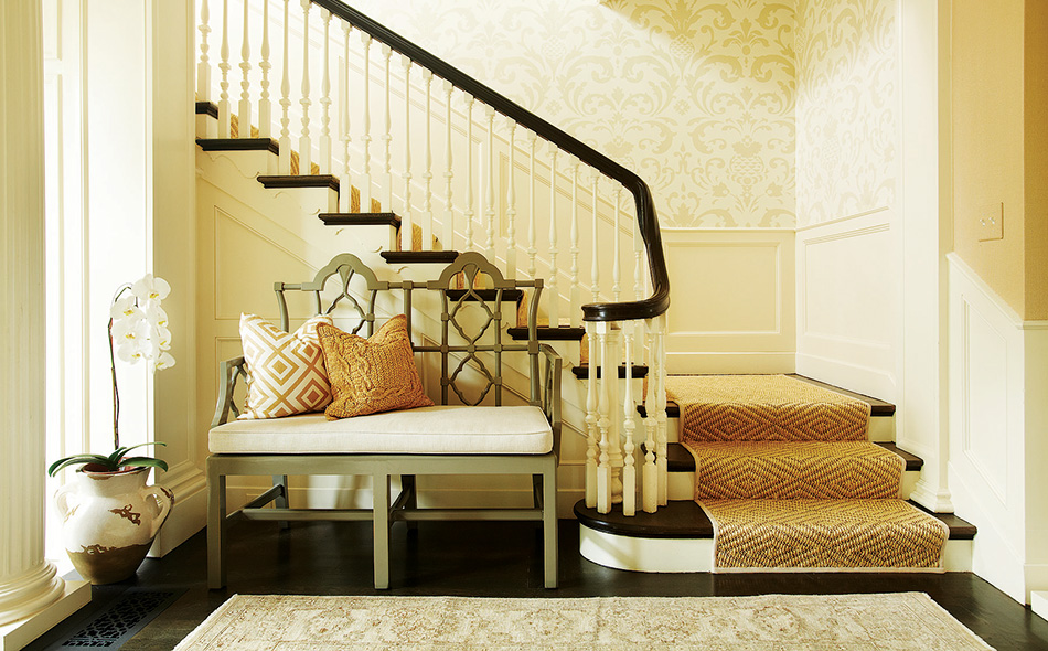 For the Westwood project, Goldberg combined the natural look of a sisal stair runner with stately Schumacher damask wallpaper.