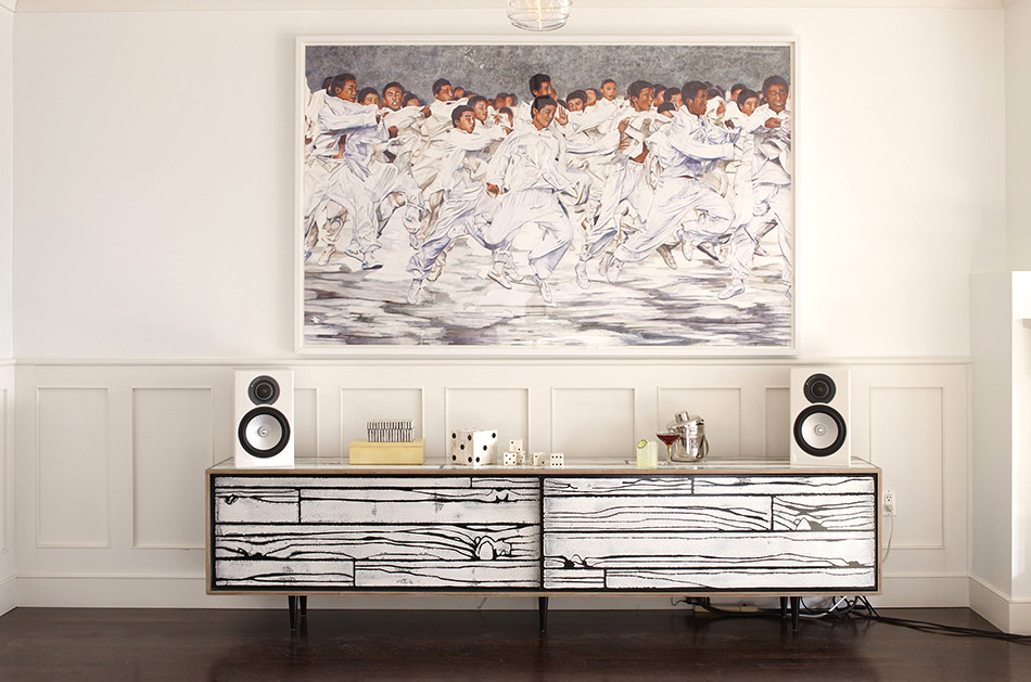 In the Noe Valley house, a credenza by Wrong Woods plays off the colors and lines in the Conrad Ruiz piece above. Photo by Mariko Reed