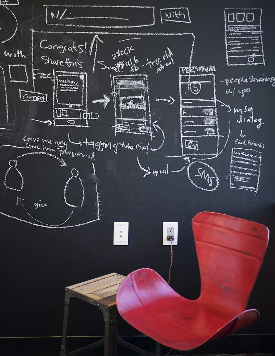 In a small phone room at the offices of Path, one of Geremia Design’s earliest clients, a vintage chair keeps company with a chalkboard wall primed for note-taking. Photo by Keeney+Law Photography