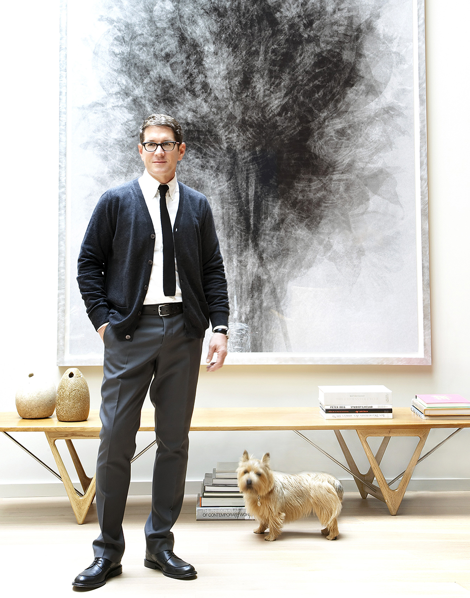 The designer, with his Norwich terrier, Harvey, stands in front of Idres Khan’s Blossfeldt...After Karl Blossfeldt ‘Art Forms in Nature’, 2005, purchased from San Francisco’s Fraenkel Gallery.
