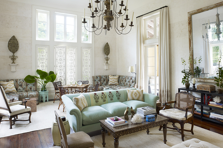 For a home in Hobe Sound, Florida, Scheerer drew inspiration from trips to Morocco, India, Cuba and Burma when creating this living room, where antiques, both French and exotic, mingle beneath 18-foot-high ceilings.