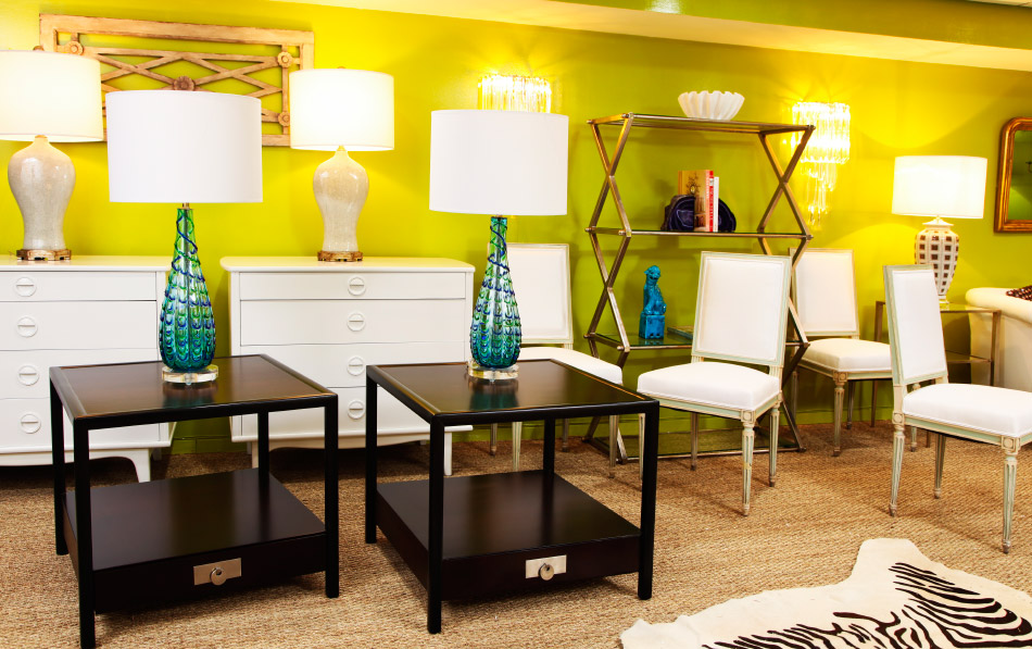 On the shop’s lower level, an acid-green wall sets off an eclectic mix of vintage pieces from the second half of the 20th century.