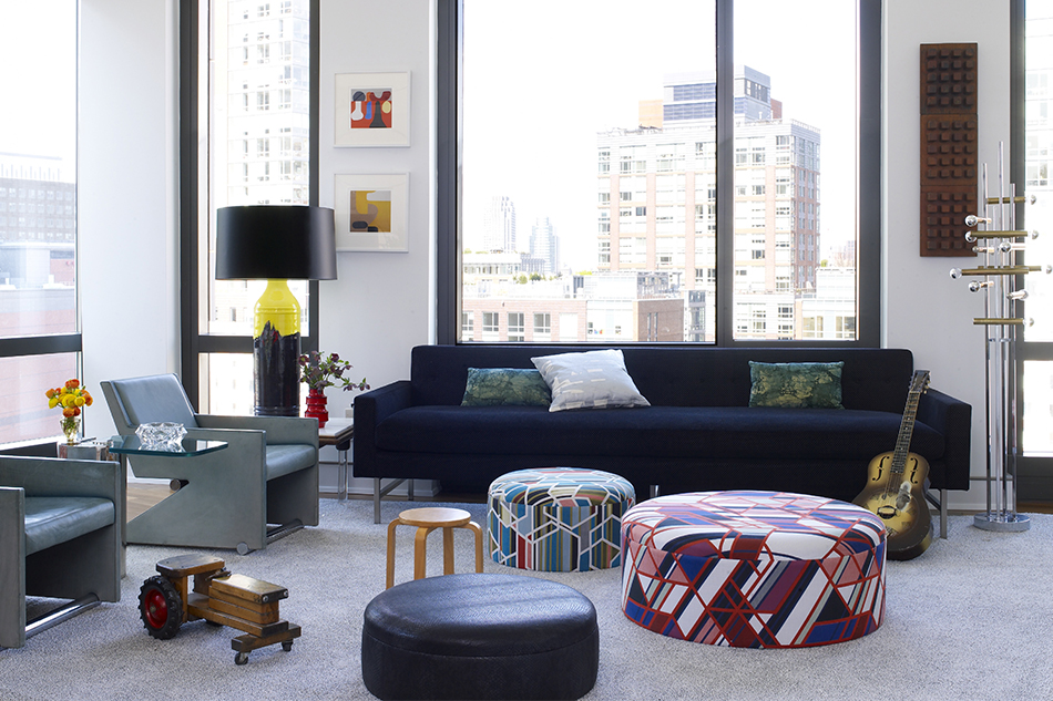 In Appleton’s living room, a child’s stool by Alvar Aalto fits in seamlessly with custom ottomans and a Gaetano Sciolari floor lamp.