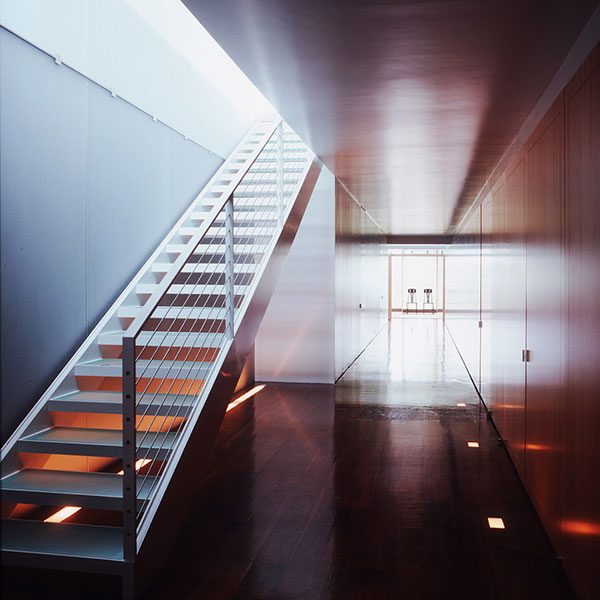 This sleek hallway is from an upstate New York house designed by Thomas Pfifer. “A photograph of an interior atempts to distill the essence of a space in two dimensions,” Waldron explains.