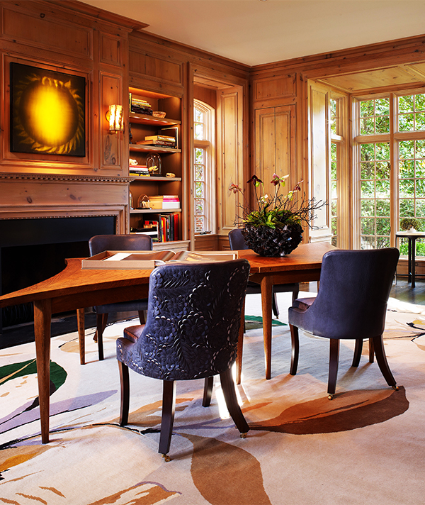 The designer doesn’t eschew the traditional altogether: In this Dallas home library, classic wood panelling provides contrast to the contemporary art and carpet by Vivian Westwood for the Rug Company. Photo by Stephen Karlisch