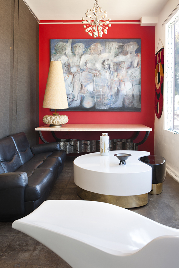 At the Michele Sommerlath space, a De Sede sofa is paired with a Ying & Yang nesting coffee table attributed to Karl Springer. The painting on the back wall is by the Scottish artist Matilda Tumin.