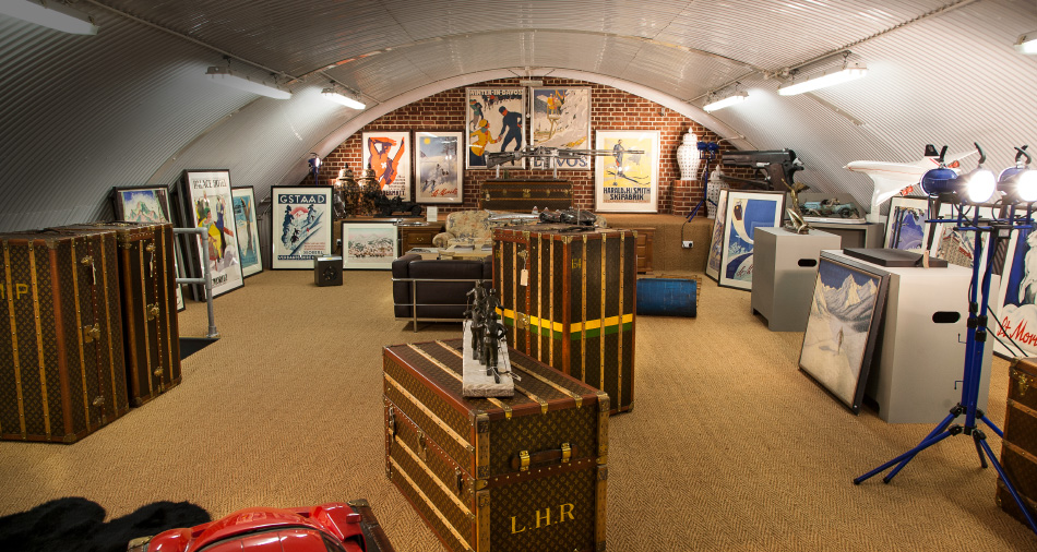 For the globe-trotting customer: original Art Deco winter sports posters hang alongside vintage Louis Vuitton trunks.