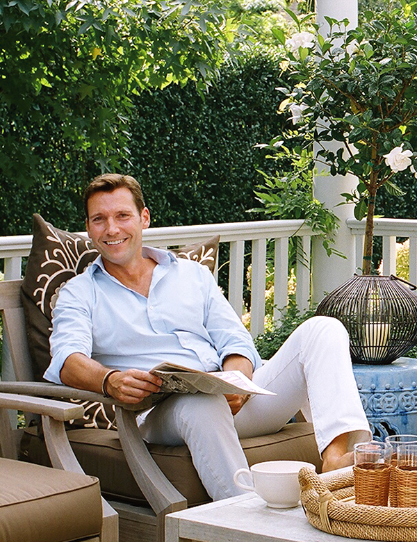 Timothy Whealon relaxes on the comfortably furnished deck of his Southampton home