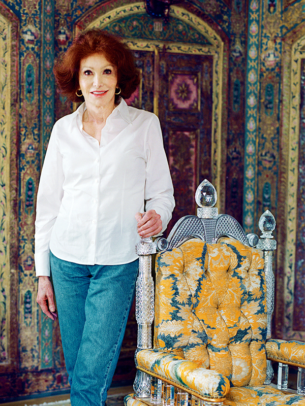 Ann Getty in her work clothes at her San Francisco home. 18th-century Syro-Turkish, hand painted, gilded and semi-precious stone-ornamented panelled guest bedroom. Cut glass-crystal throne chair (circa 1894, Birmingham, England) from F & C Osler. Photo exclusive by Lisa Romerein. Top: In the romantic dining room of the Trainas' house, the folding dining chairs are from the Ann Getty House Collection. Custom-colored and printed velvet on the banquettes is by Venice-based Sabina Fay Braxton. The peacocks, from Deyrolle, were a gift from Danielle Steel.