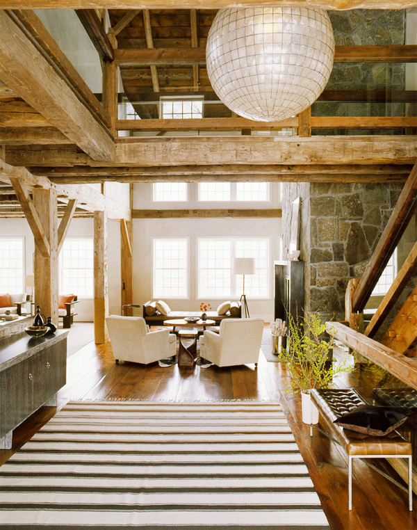 A Washington, Connecticut, residence, with a large capiz shell chandelier above the entryway and beautiful exposed wood beams, hints at interior designer S. Russell Groves's nature-inspired aesthetic. Photo by Eric Piasecki. Preceding page: photo courtesy of SRG.