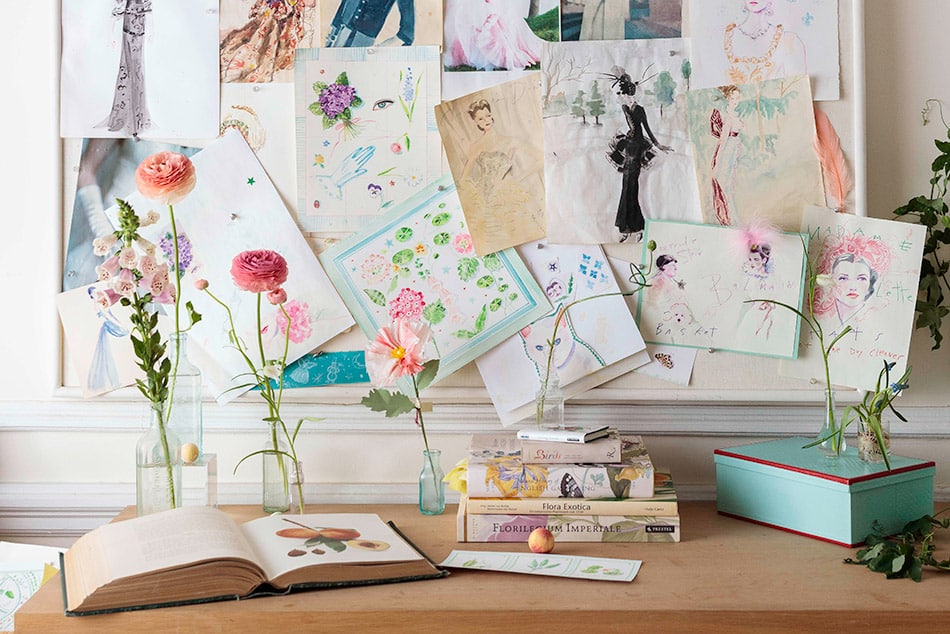 desk with books and flowers
