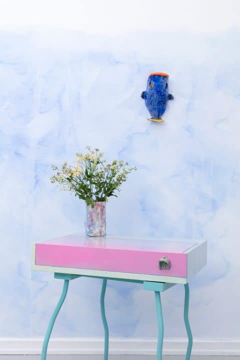 A desk and Néné wall lamp by the French duo Superpoly