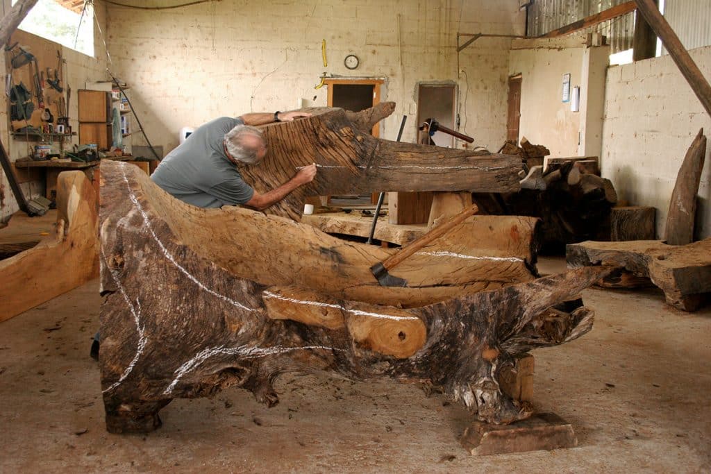 Hugo França creates a piece of furniture in his studio